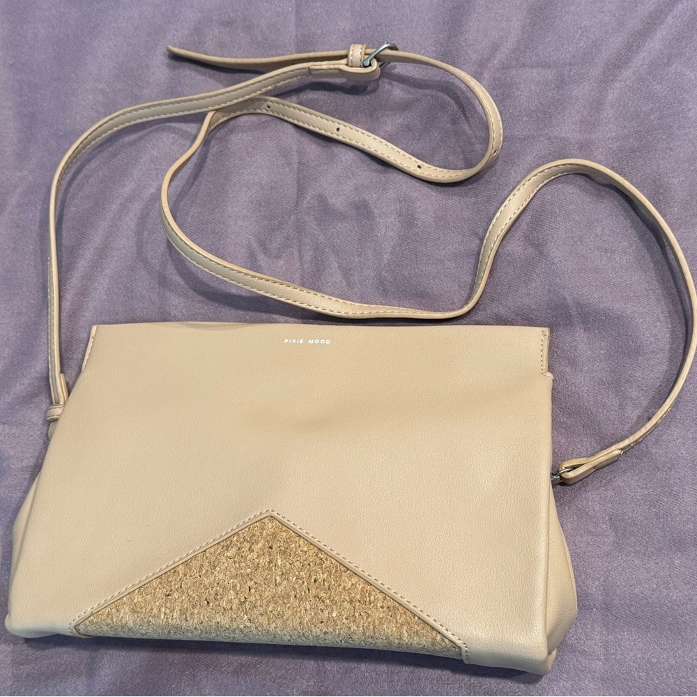 Pixie Mood Cream Crossbody Bag with adjustable strap.